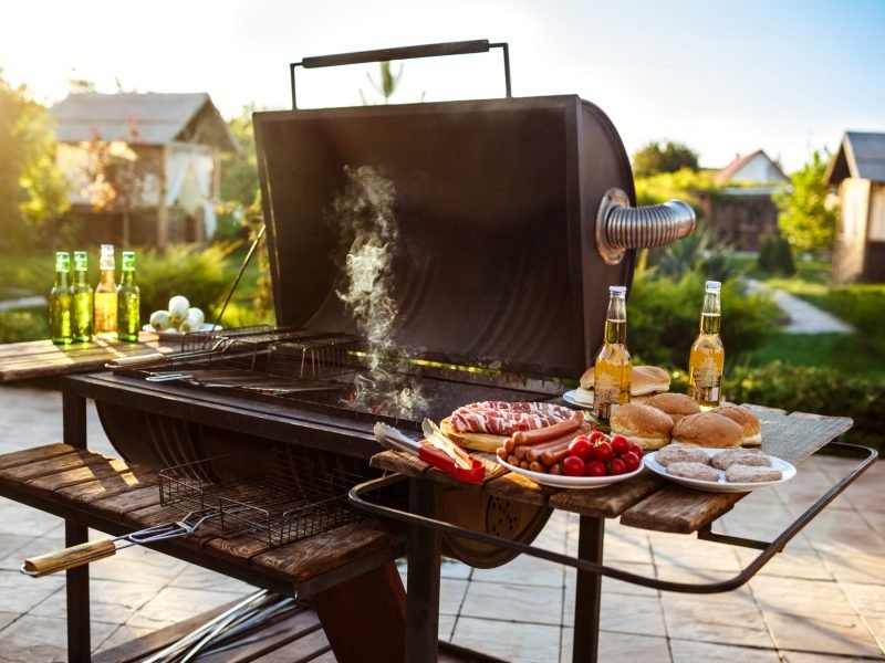 Barbecue grill party. Tasty food on wooden desk. Copy space.
